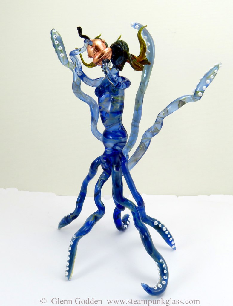The rapture, glass sculpture of figure with tentacle and copper guilded divers helment