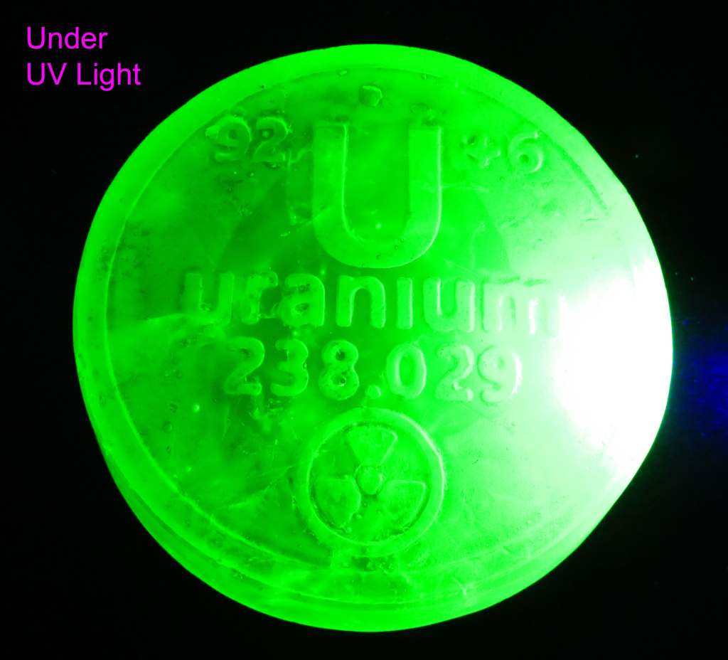 uranium glass paperweight, kiln cast with raised text, handmade modern glass